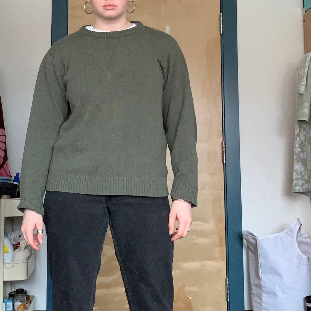 A large forest green light knit sweater